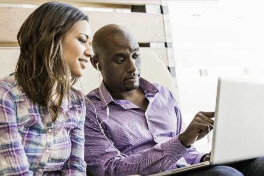 A digital expert showing a customer their website